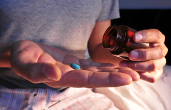Blue pill in hand